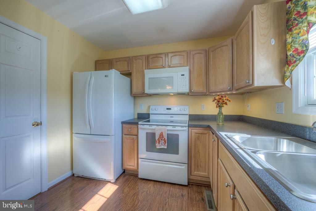 9288 Stonegate Lane Rhoadesville, VA 22542 - Photo 15 of 53 Large pantry, double stainless sink, microwave