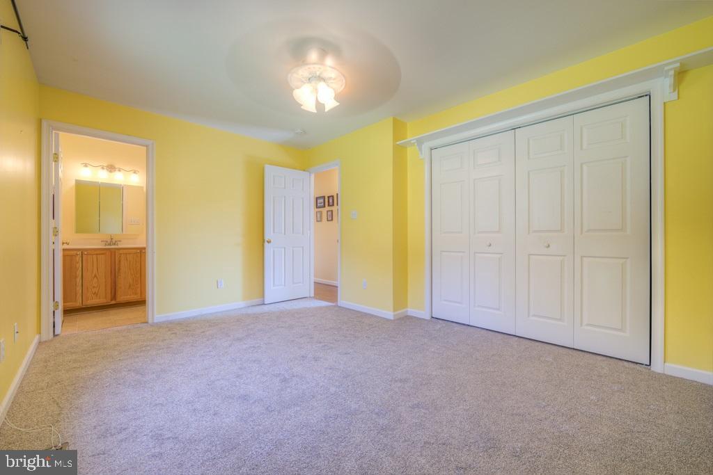 9288 Stonegate Lane Rhoadesville, VA 22542 - Photo 23 of 53 Primary Bedroom has large closet private bathroom