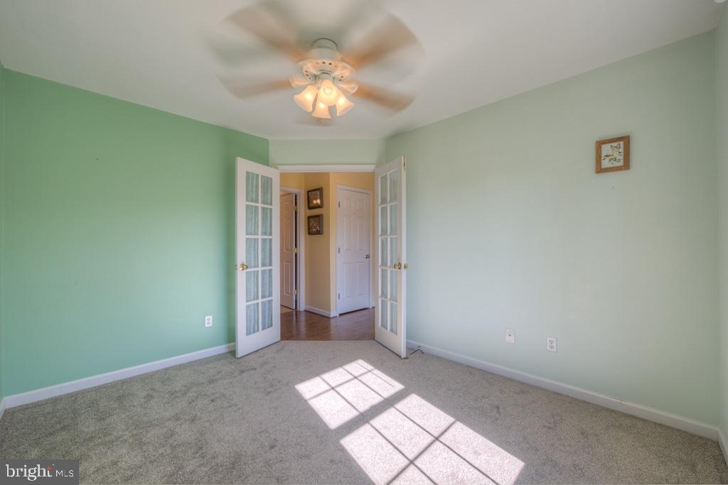 9288 Stonegate Lane Rhoadesville, VA 22542 - Photo 27 of 53 Front Bedroom #3 has french doors