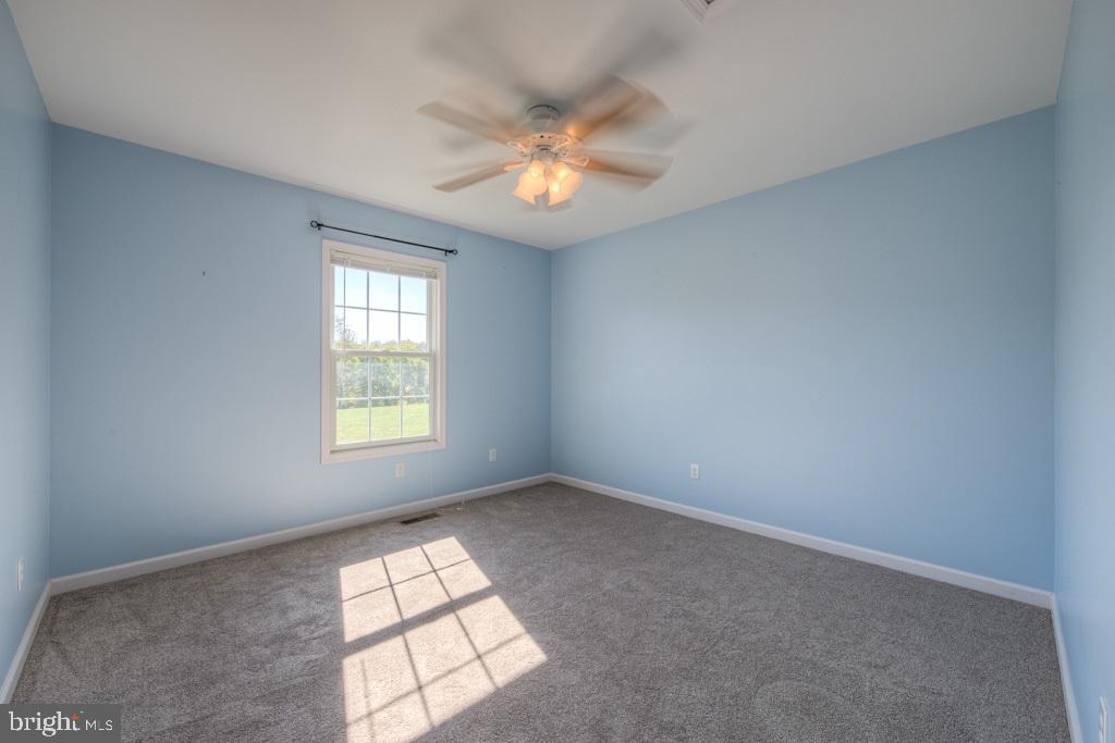 9288 Stonegate Lane Rhoadesville, VA 22542 - Photo 31 of 53 Bedroom #2 also has a ceiling fan & view of pond!