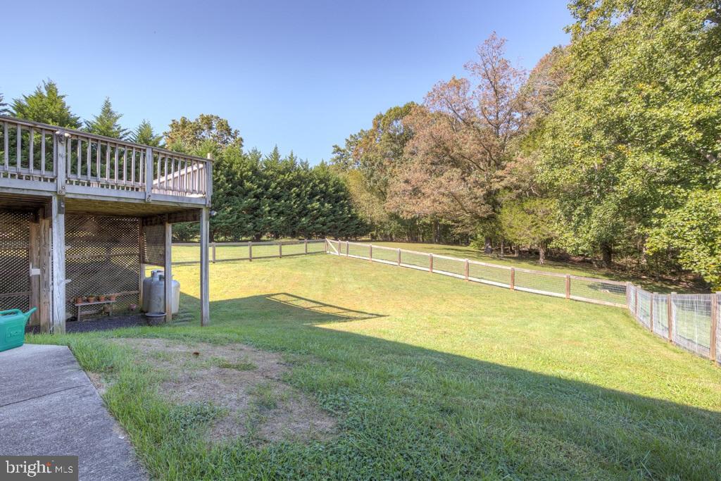 9288 Stonegate Lane Rhoadesville, VA 22542 - Photo 36 of 53 Renr Yard is fenced!! sidewalk to deck