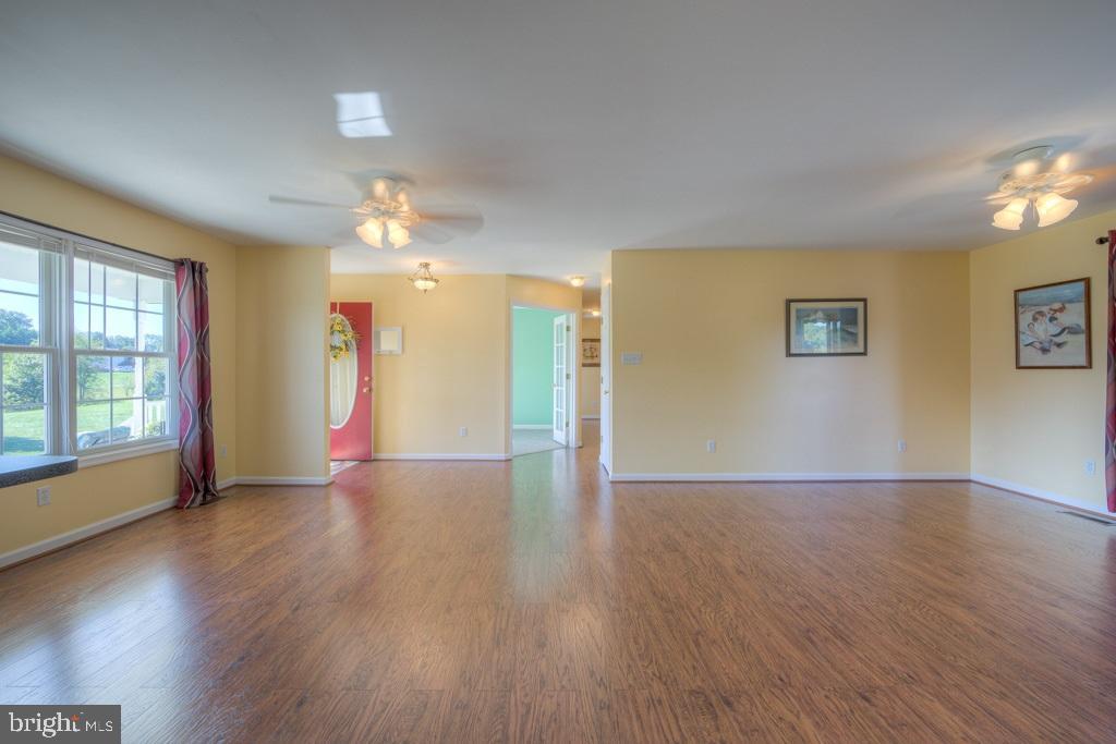 9288 Stonegate Lane Rhoadesville, VA 22542 - Photo 8 of 53 Laminate flooring in the open Great Room