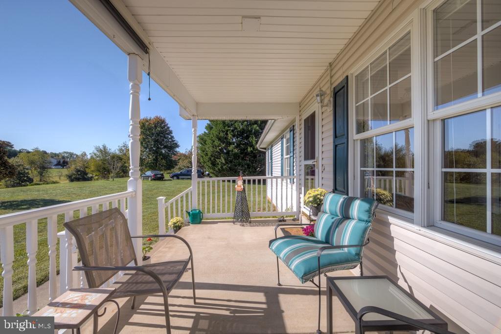9288 Stonegate Lane Rhoadesville, VA 22542 - Photo 10 of 53 Relaxing on the 16 X 8 concrete floor front porch