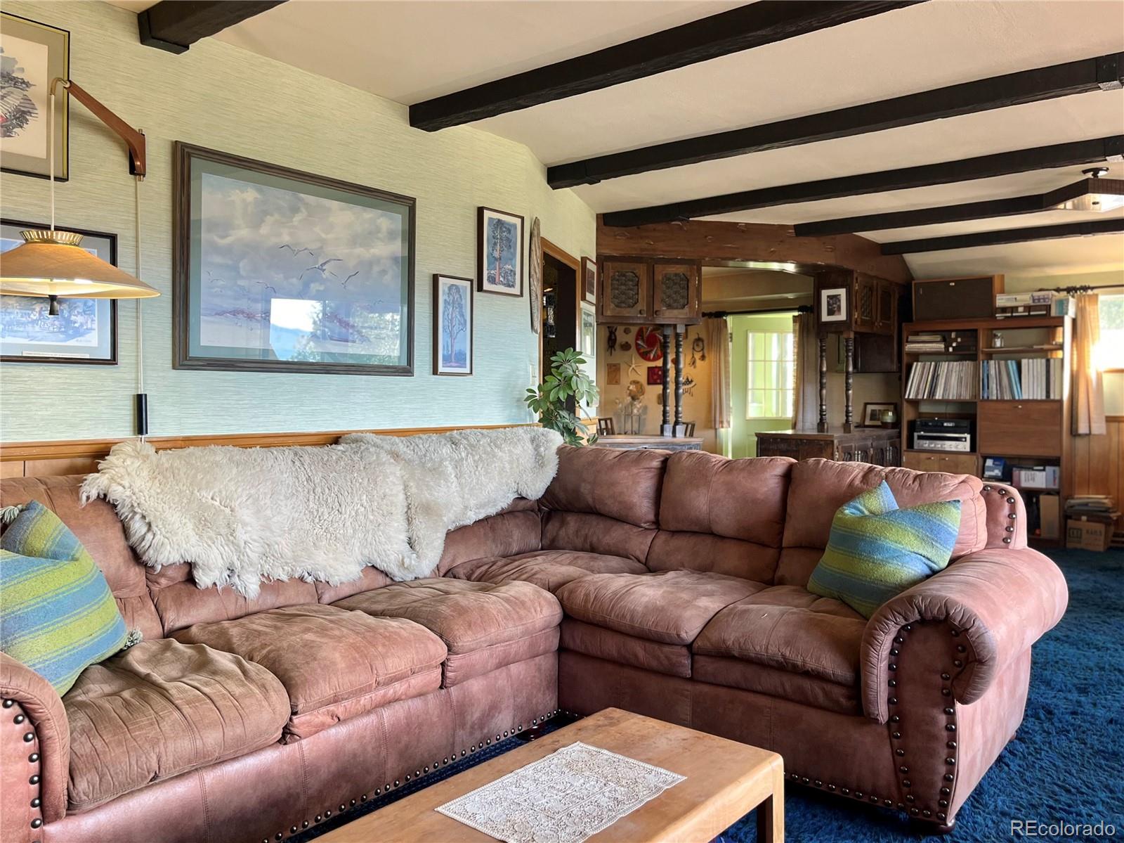 160 South Circle Drive Bailey, CO 80421 - Photo 14 of 26 a living room with furniture and painting on the wall