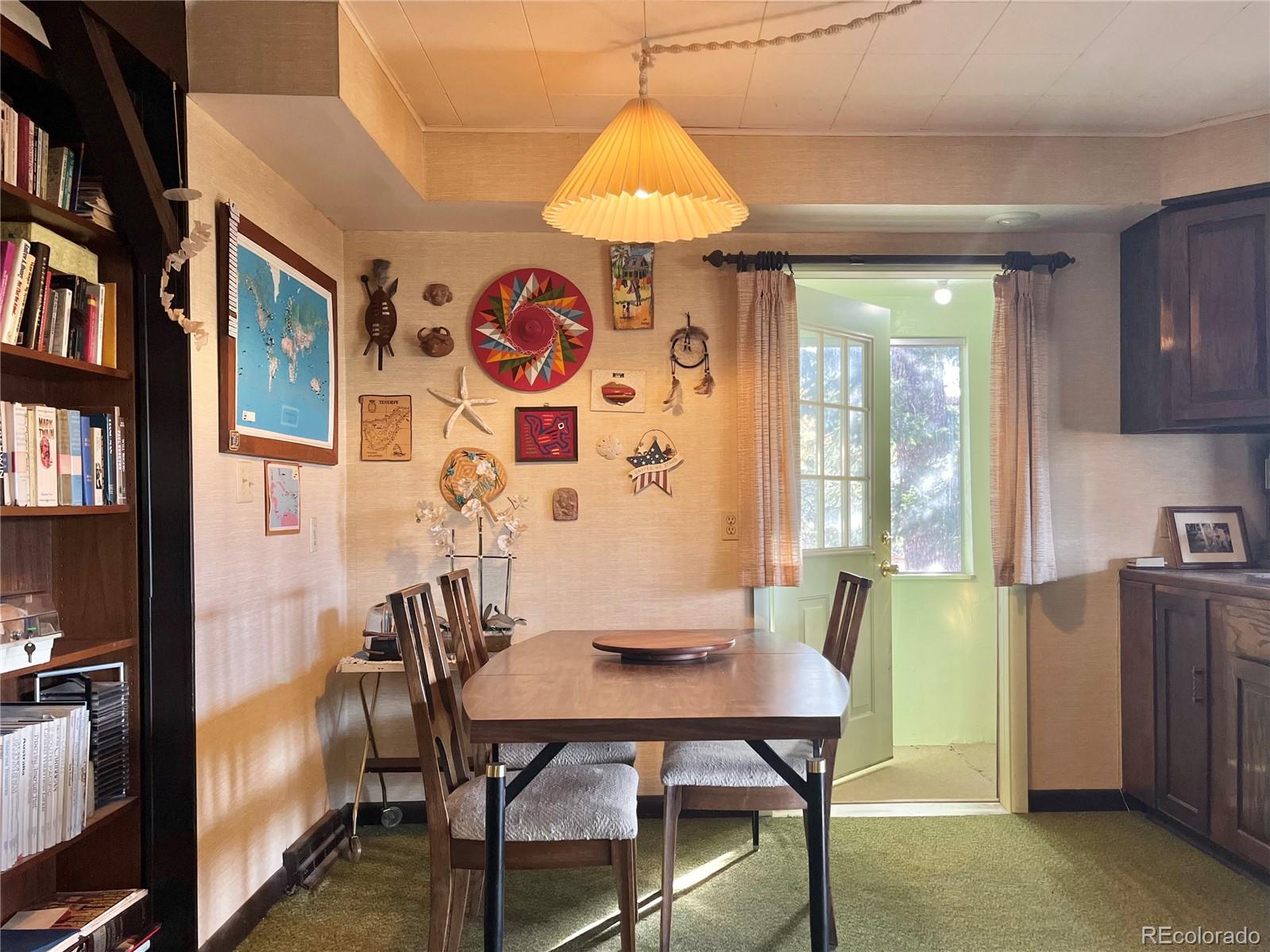 160 South Circle Drive Bailey, CO 80421 - Photo 6 of 26 a view of a dining room with furniture and chandelier