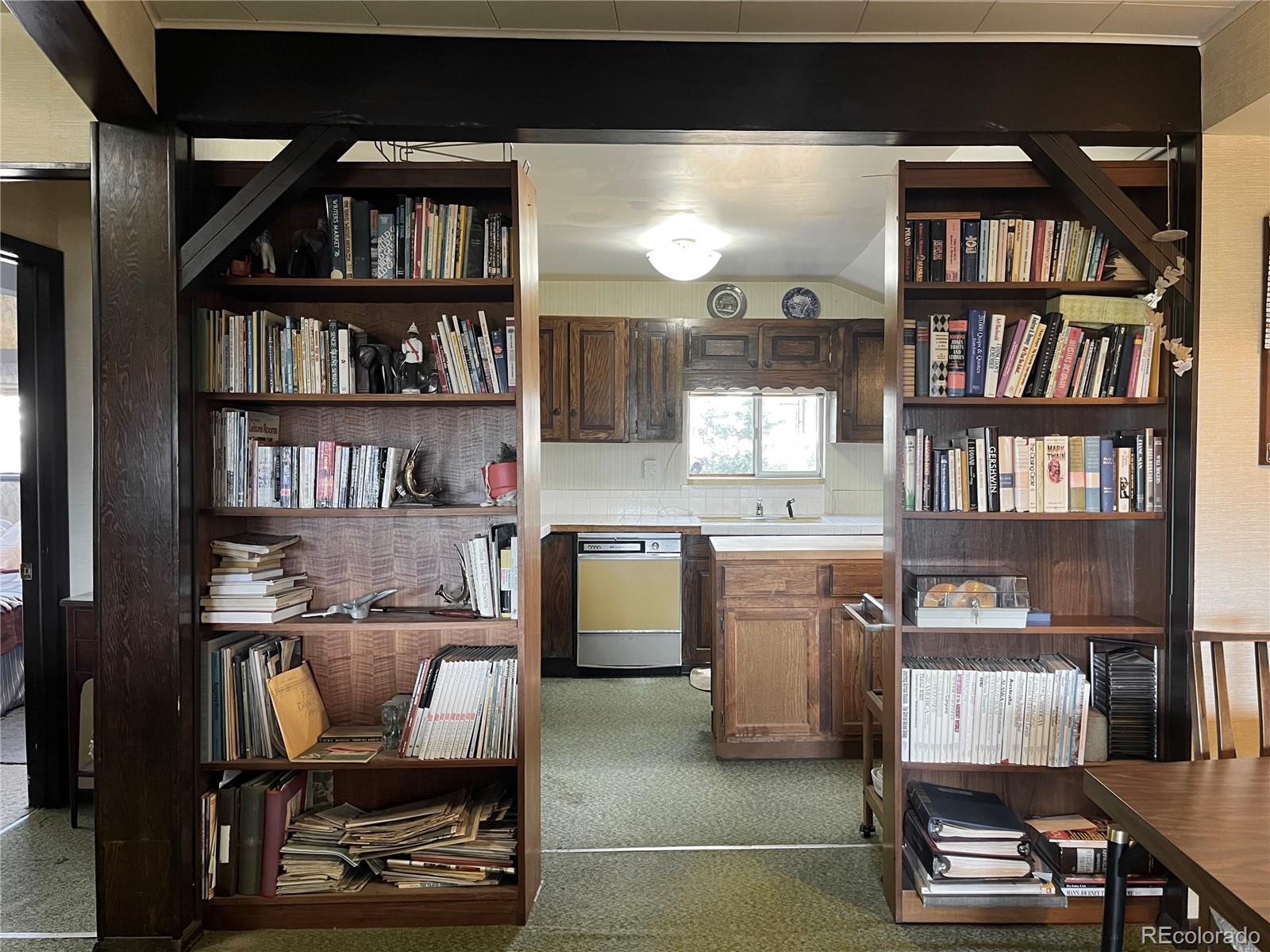 160 South Circle Drive Bailey, CO 80421 - Photo 7 of 26 a workspace with a bookshelf