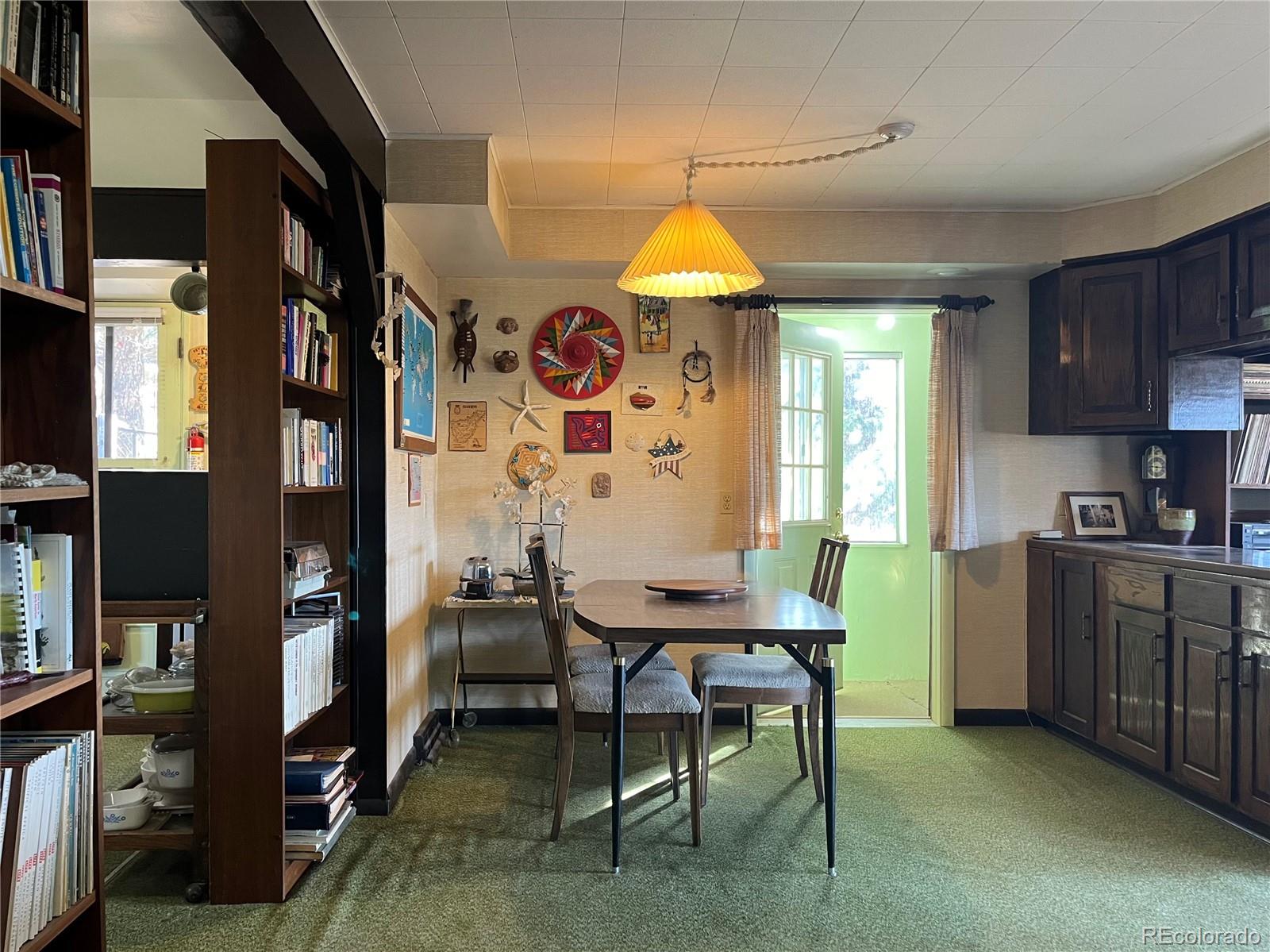 160 South Circle Drive Bailey, CO 80421 - Photo 8 of 26 a view of a kitchen and a dining room