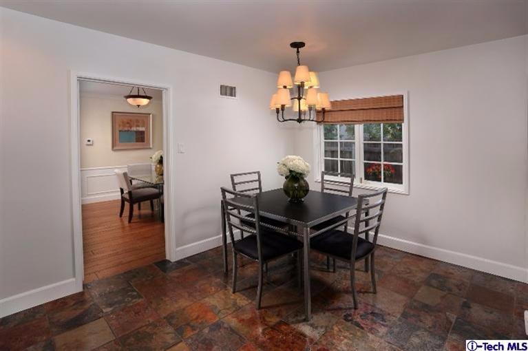 1915 Cañada Boulevard Glendale, CA 91208 - Photo 15 of 42 a view of a dining room with furniture and chandelier