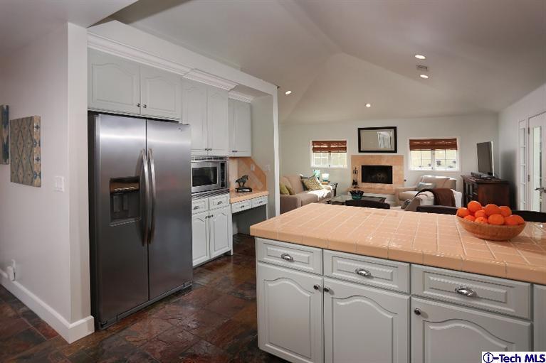 1915 Cañada Boulevard Glendale, CA 91208 - Photo 19 of 42 a kitchen with cabinets and stainless steel appliances