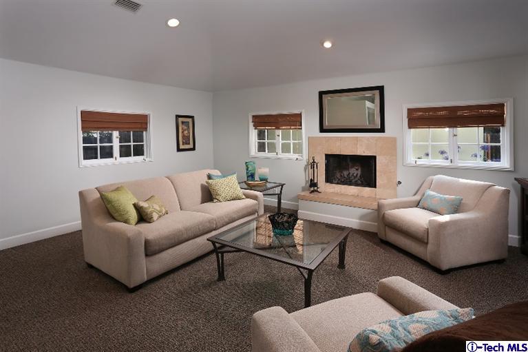 1915 Cañada Boulevard Glendale, CA 91208 - Photo 23 of 42 a living room with furniture and a fireplace