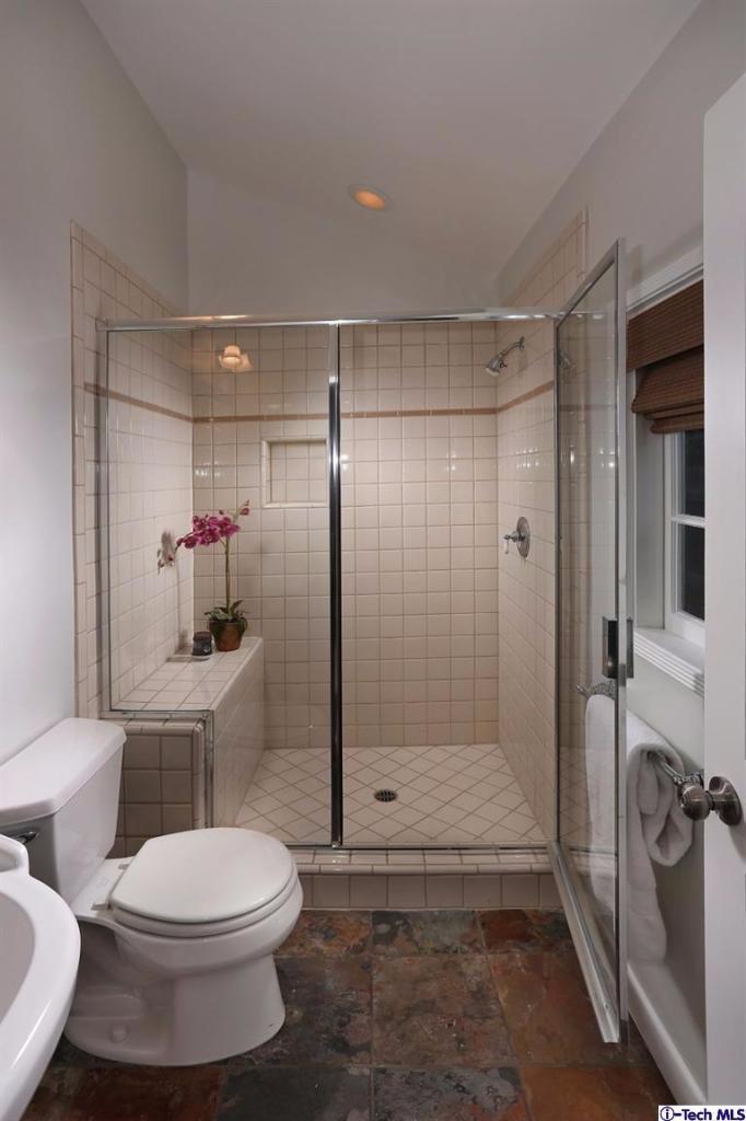 1915 Cañada Boulevard Glendale, CA 91208 - Photo 24 of 42 a bathroom with a toilet and a shower