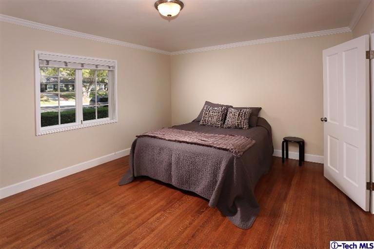 1915 Cañada Boulevard Glendale, CA 91208 - Photo 26 of 42 a bedroom with a bed and a window