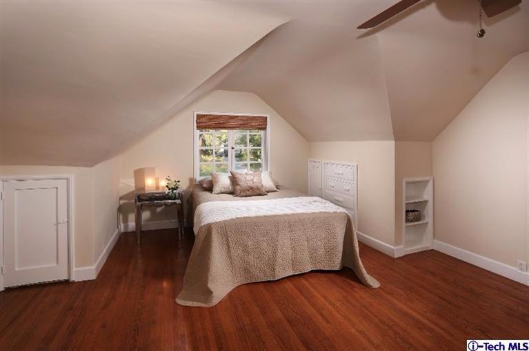 1915 Cañada Boulevard Glendale, CA 91208 - Photo 30 of 42 a bedroom with a bed and wooden floor