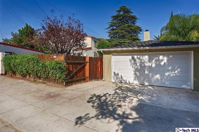 1915 Cañada Boulevard Glendale, CA 91208 - Photo 42 of 42 a view of a house with a yard and a garage