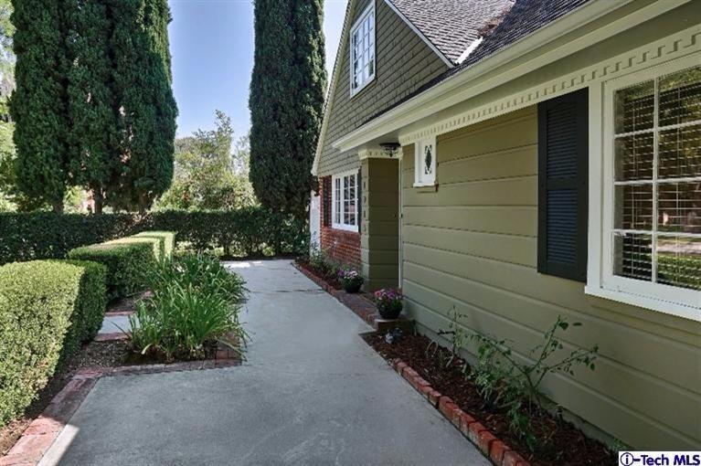 1915 Cañada Boulevard Glendale, CA 91208 - Photo 6 of 42 a front view of a house with a yard