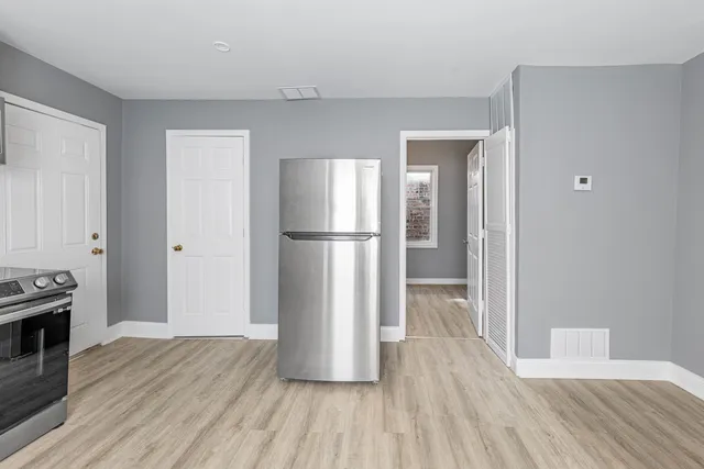 a view of kitchen space with wooden floor