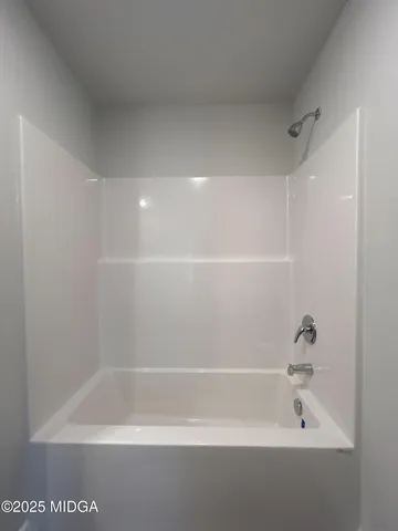 a close up of a bathtub in a bathroom