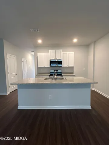 a view of kitchen with wooden floor