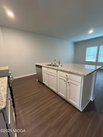 a room with a sink and a mirror