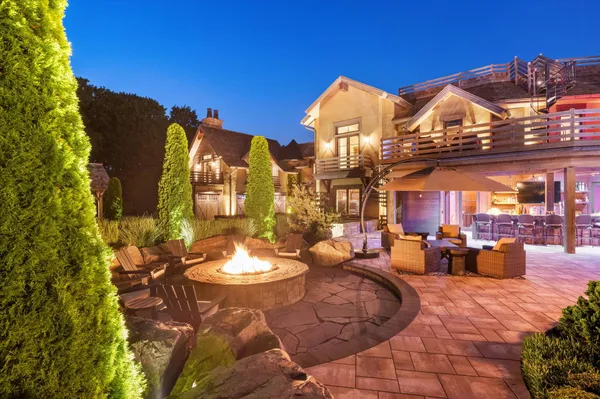 a view of a patio with couches chairs and potted plants