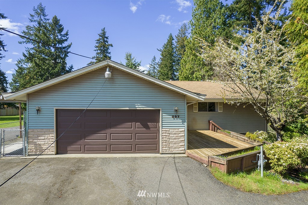 807 Union Street Northeast Renton, WA 98056 - Photo 1 of 38 a house with trees in the background