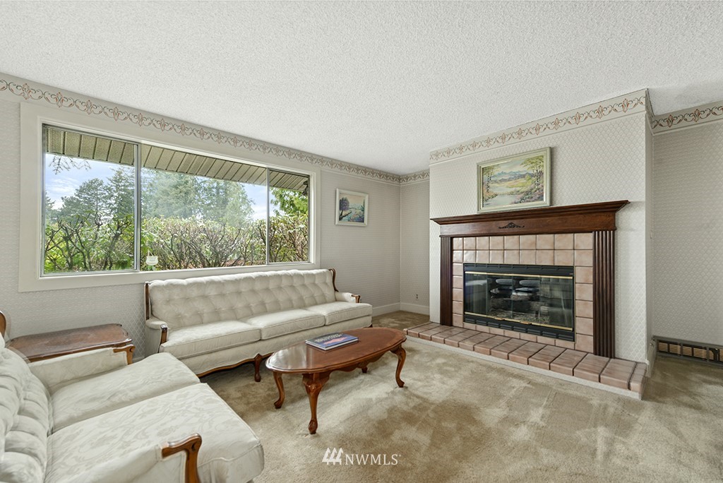 807 Union Street Northeast Renton, WA 98056 - Photo 11 of 38 a living room with furniture and a fireplace