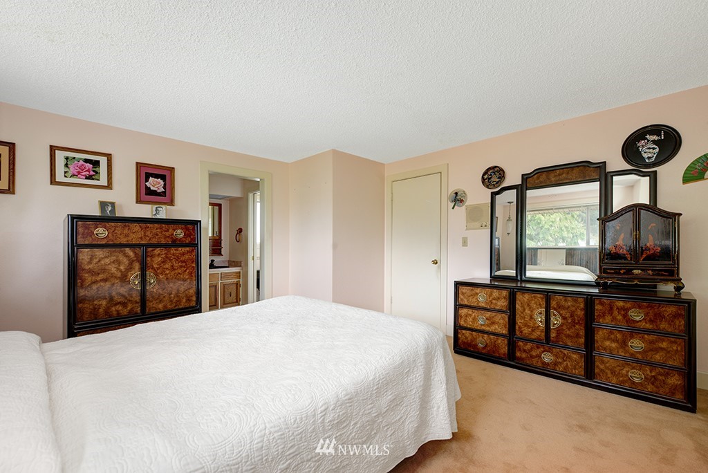 807 Union Street Northeast Renton, WA 98056 - Photo 16 of 38 a bedroom with a bed and a large window