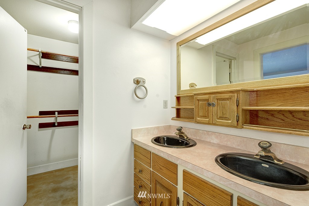 807 Union Street Northeast Renton, WA 98056 - Photo 18 of 38 a bathroom with a sink and a mirror