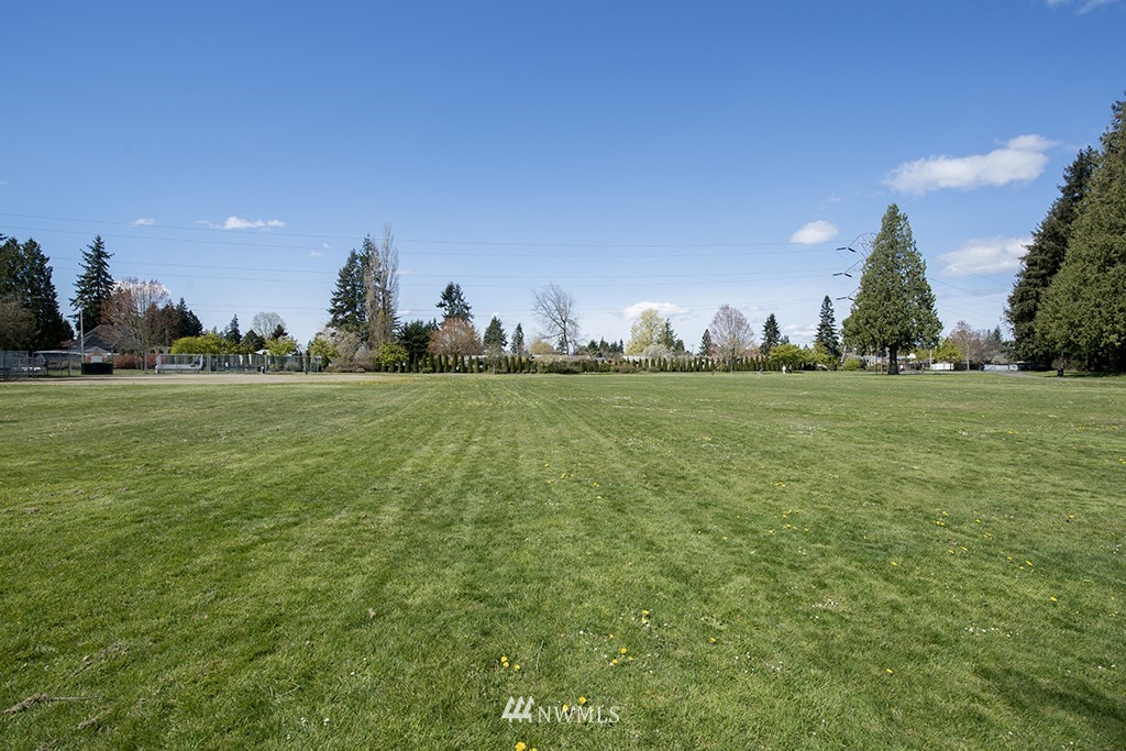 807 Union Street Northeast Renton, WA 98056 - Photo 33 of 38 a view of a big yard with a house in the background