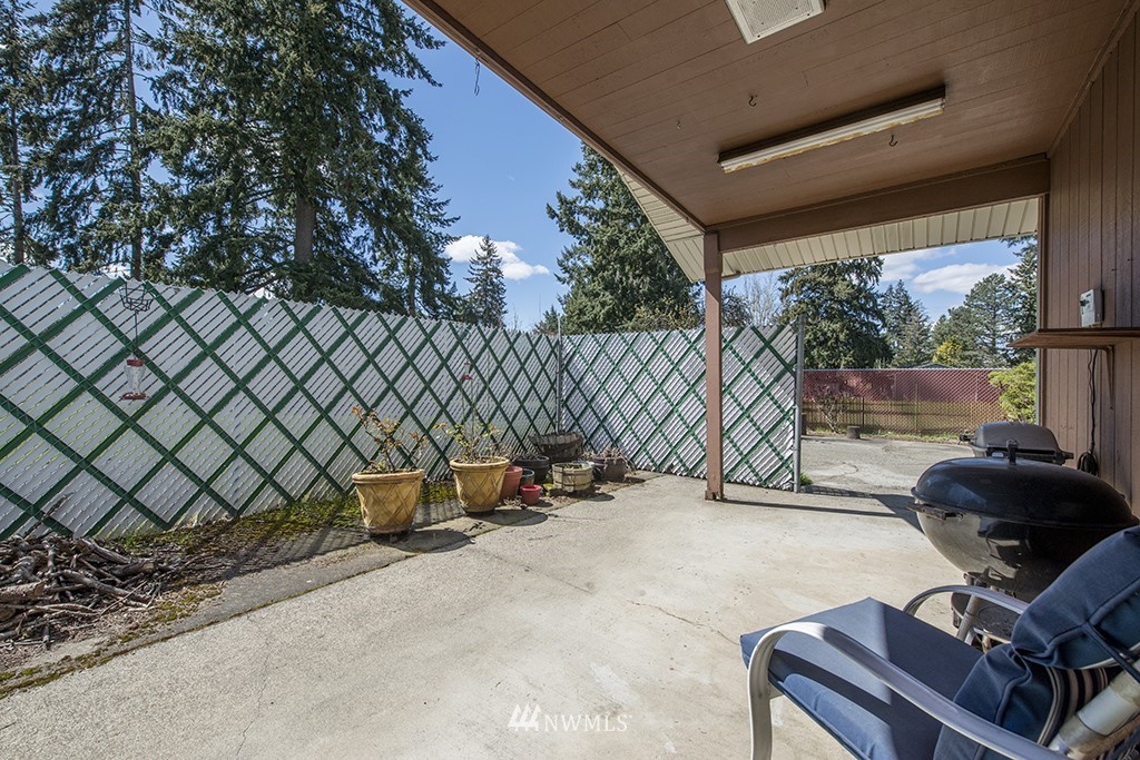 807 Union Street Northeast Renton, WA 98056 - Photo 34 of 38 a view of backyard with furniture and iron fence