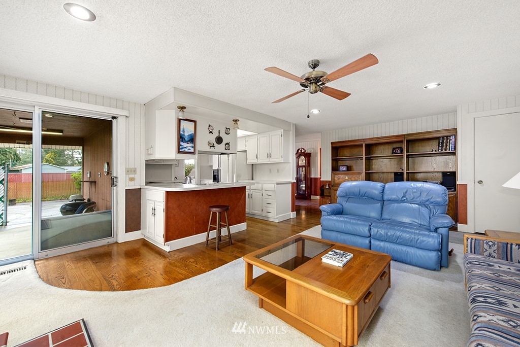 807 Union Street Northeast Renton, WA 98056 - Photo 6 of 38 a living room with furniture and a wooden floor