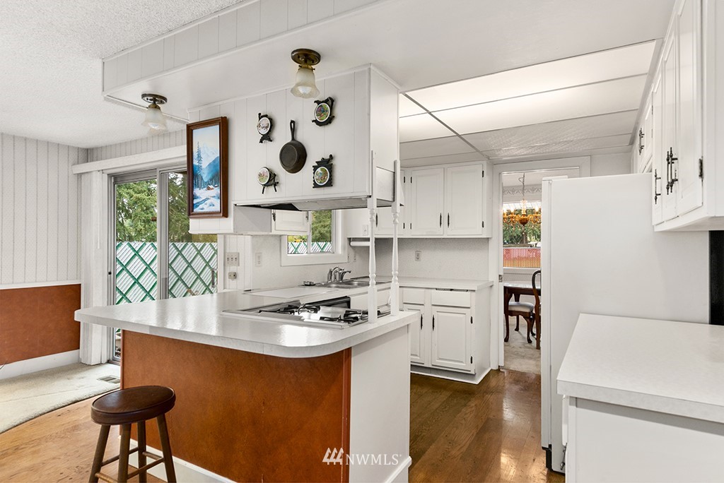 807 Union Street Northeast Renton, WA 98056 - Photo 9 of 38 a kitchen with a refrigerator and a stove