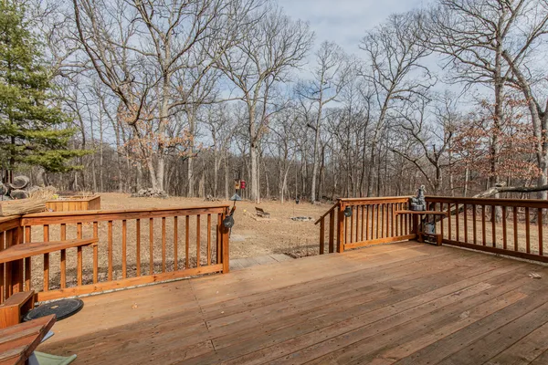 a view of outdoor space with deck and garden
