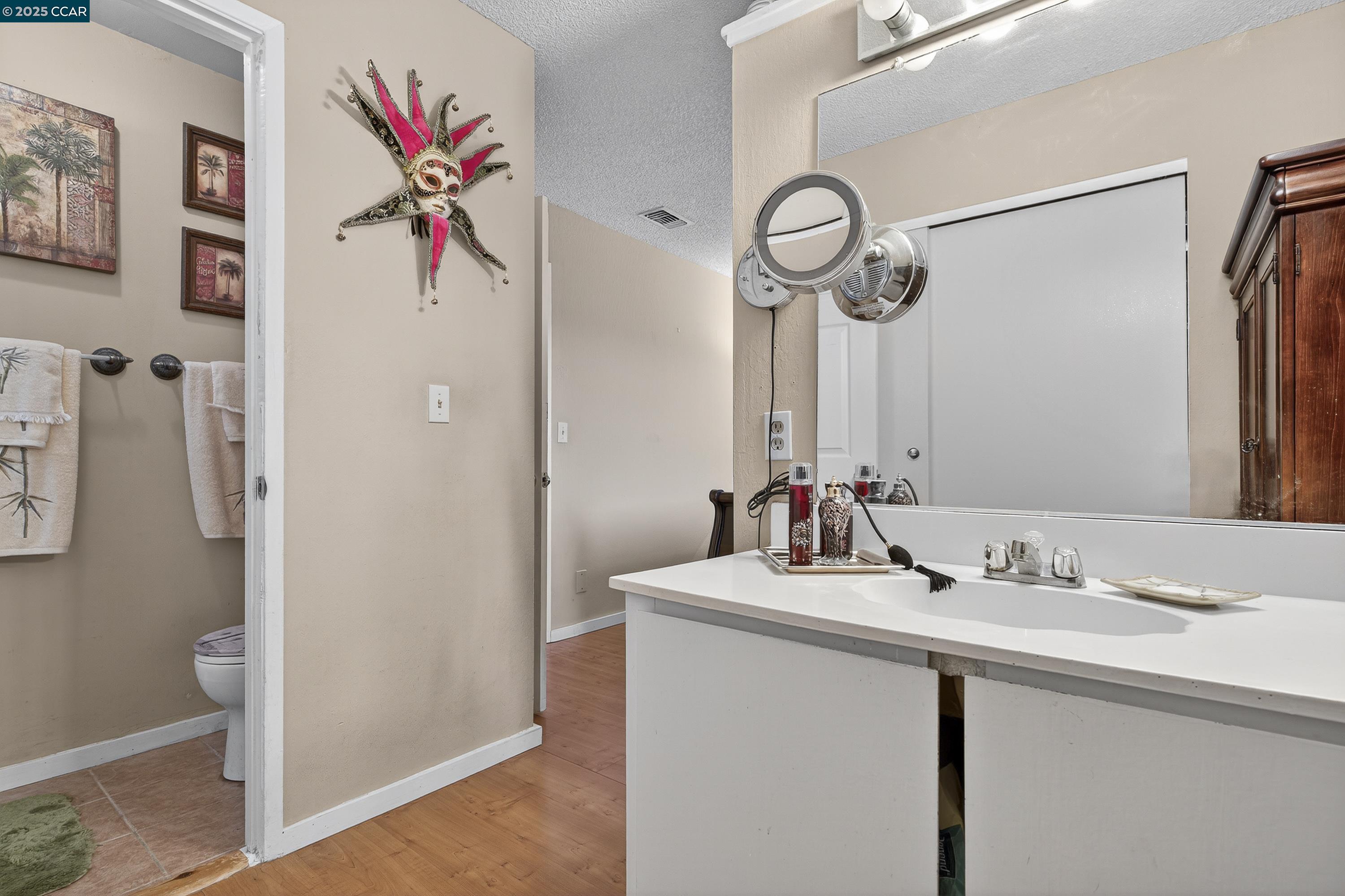 817 Ketch Court Rodeo, CA 94572 - Photo 26 of 45 a bathroom with a sink and a mirror