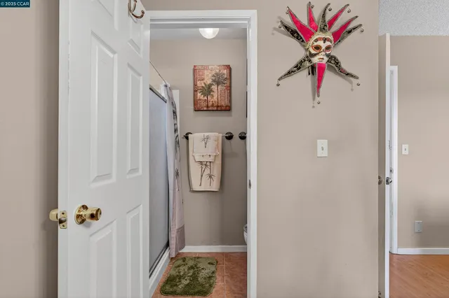 a bathroom with a shower and a sink