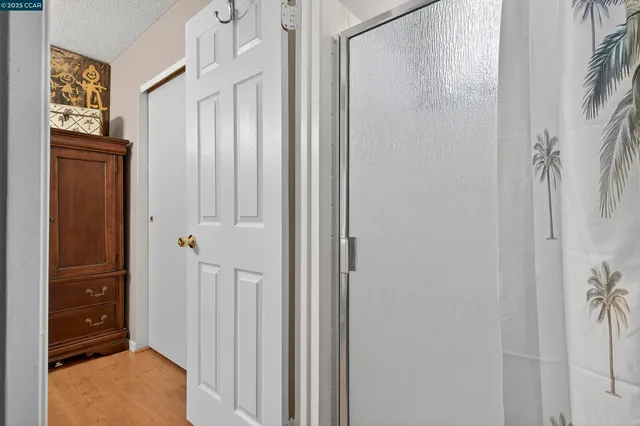 a bedroom with a bed and a table in it