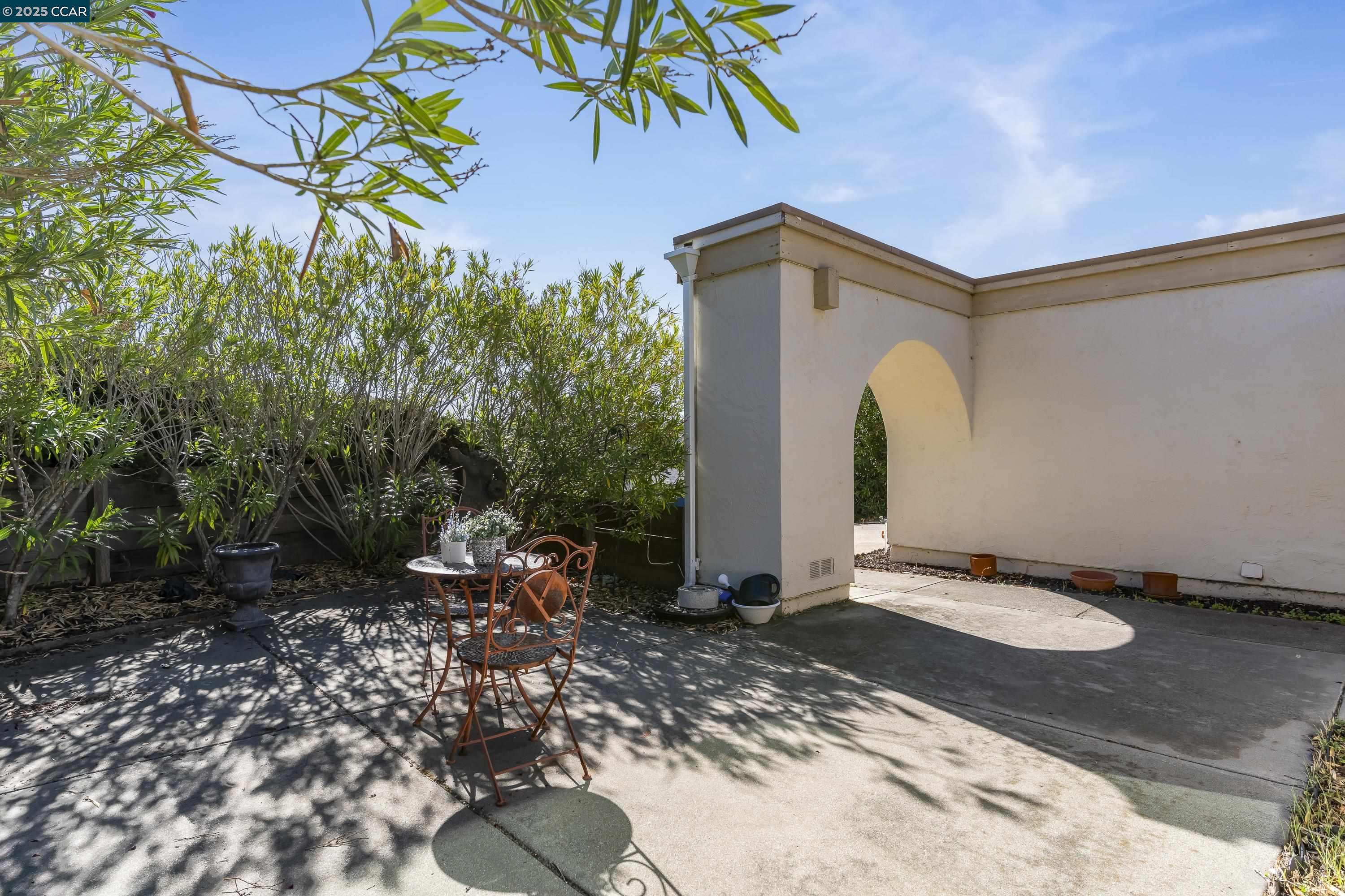 817 Ketch Court Rodeo, CA 94572 - Photo 3 of 45 a backyard of a house with table and chairs