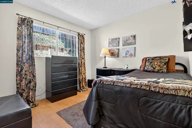 a bed room with a bed and a lamp