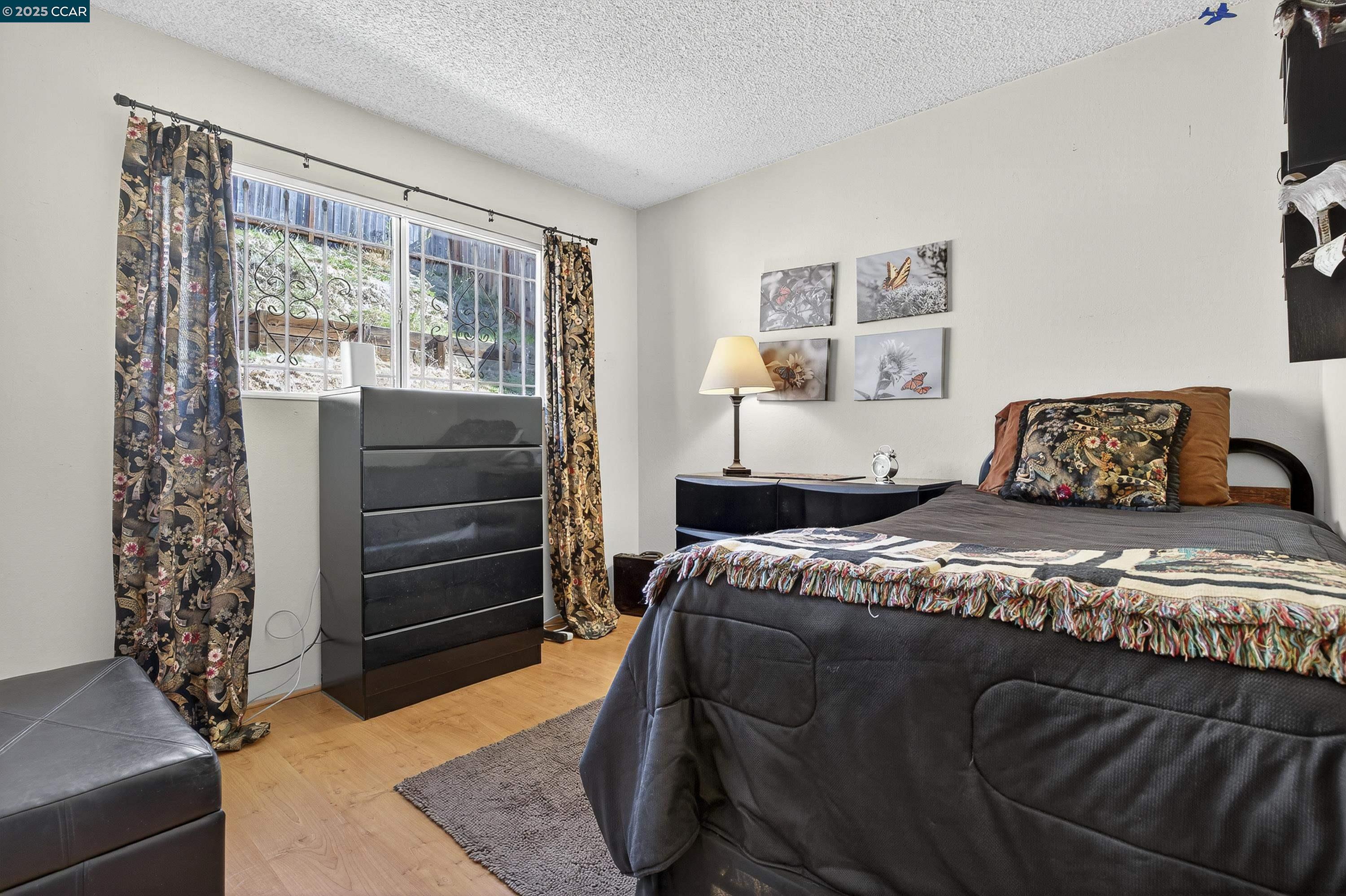 817 Ketch Court Rodeo, CA 94572 - Photo 34 of 45 a bedroom with a bed and a window