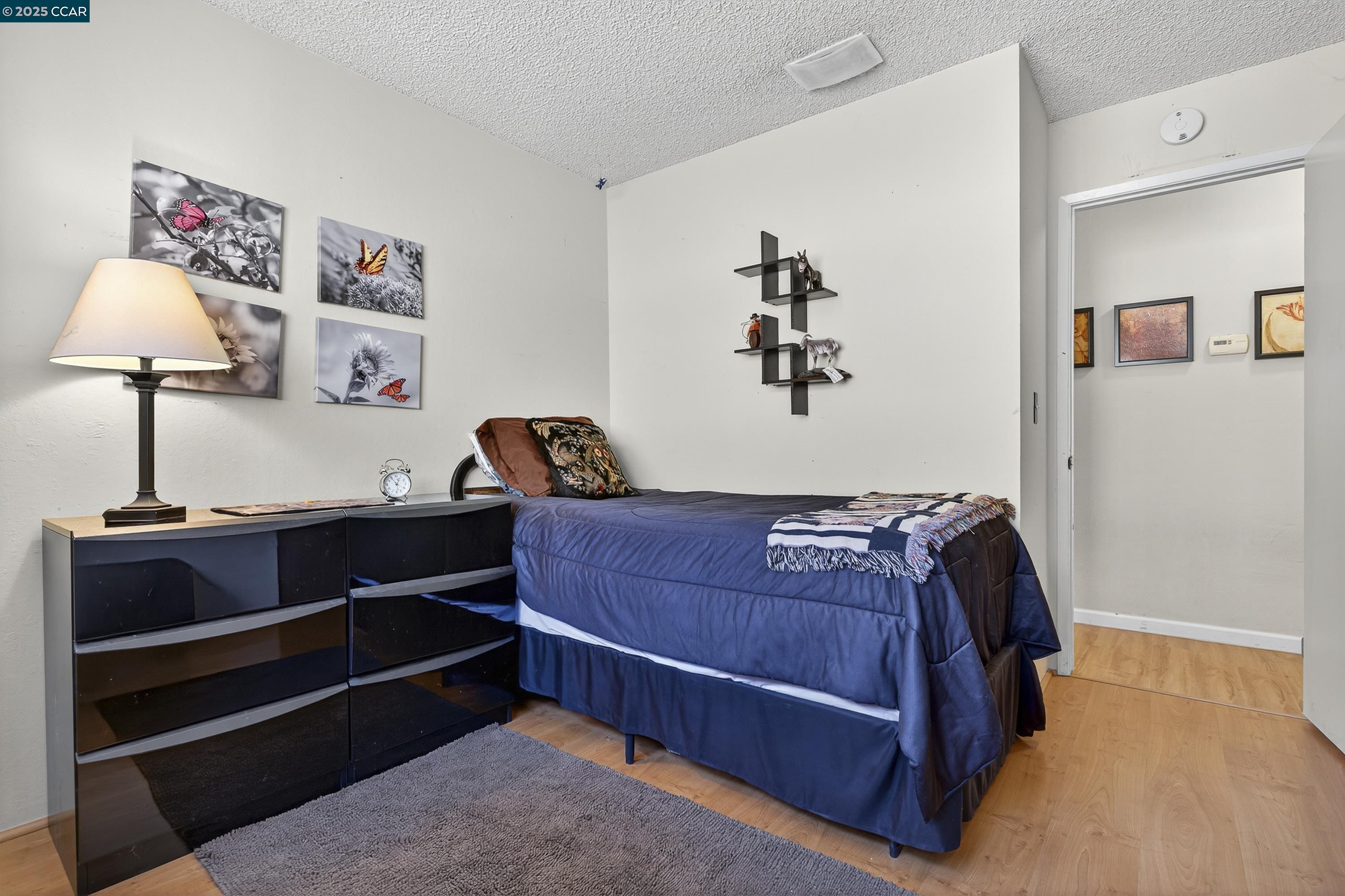 817 Ketch Court Rodeo, CA 94572 - Photo 35 of 45 a bed room with a bed and a lamp