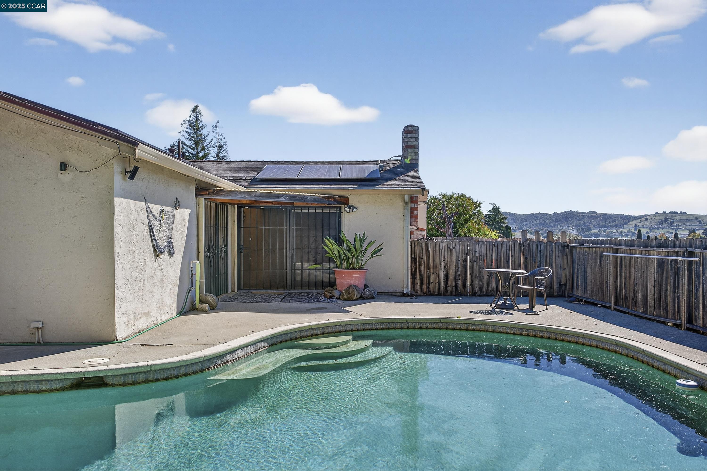 817 Ketch Court Rodeo, CA 94572 - Photo 40 of 45 a swimming pool with outdoor seating and yard