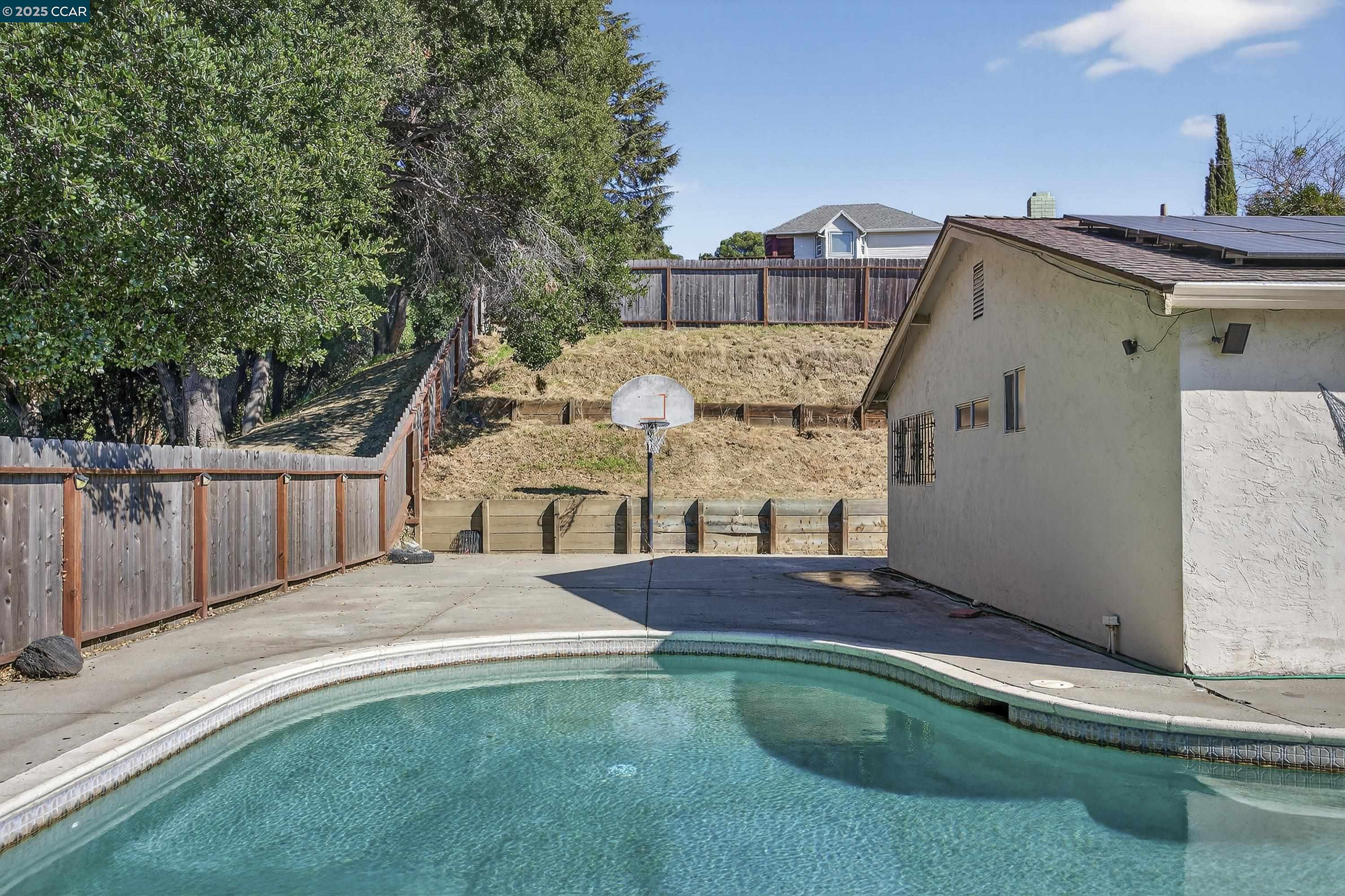 817 Ketch Court Rodeo, CA 94572 - Photo 45 of 45 a view of a house with a small yard and wooden fence