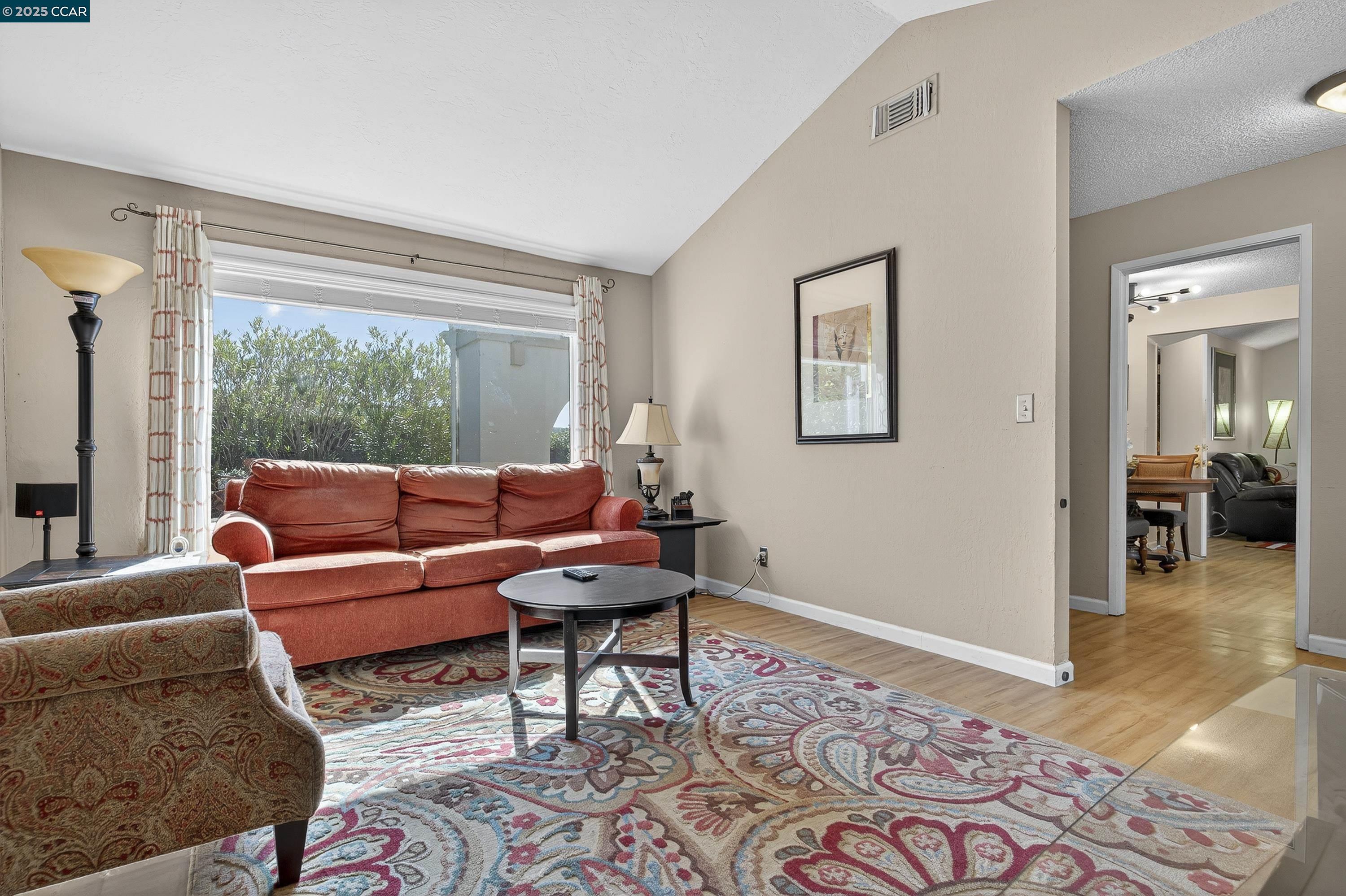 817 Ketch Court Rodeo, CA 94572 - Photo 5 of 45 a living room with furniture and a window