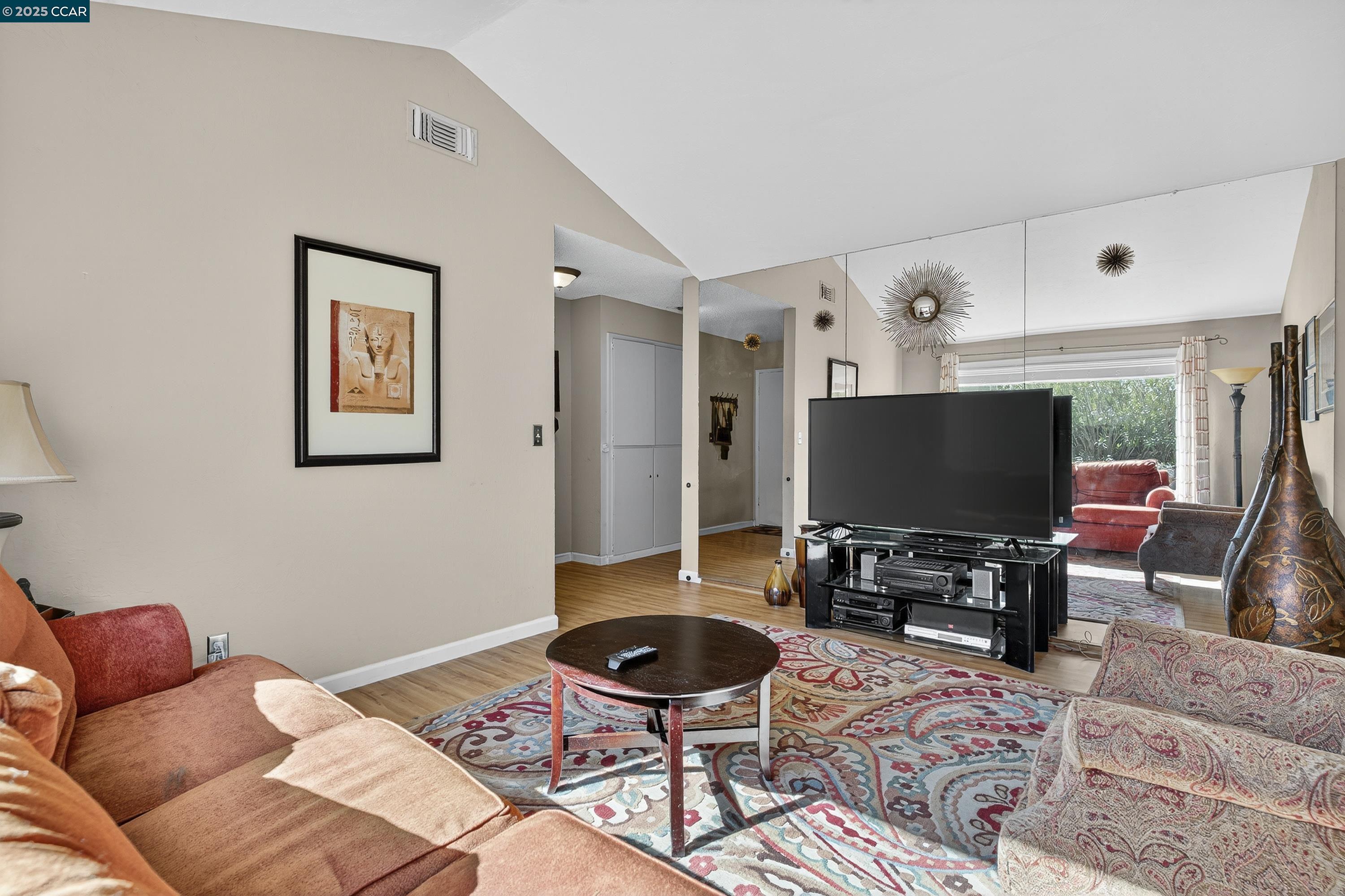 817 Ketch Court Rodeo, CA 94572 - Photo 6 of 45 a living room with furniture and a flat screen tv