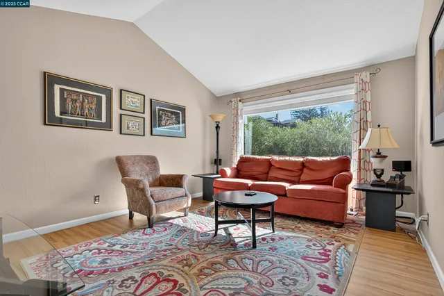 a living room with furniture and a rug