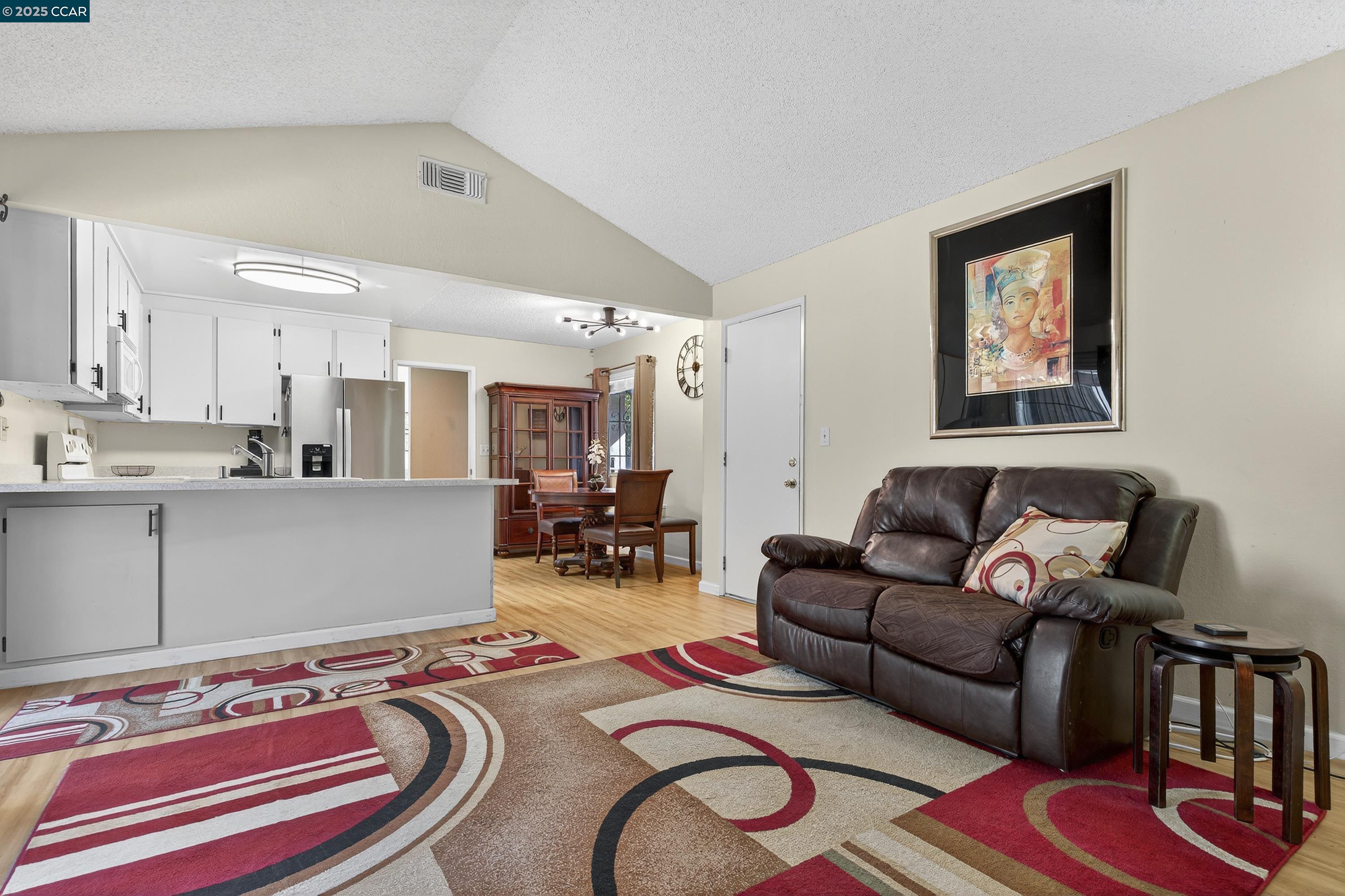817 Ketch Court Rodeo, CA 94572 - Photo 10 of 45 a living room with furniture and a rug