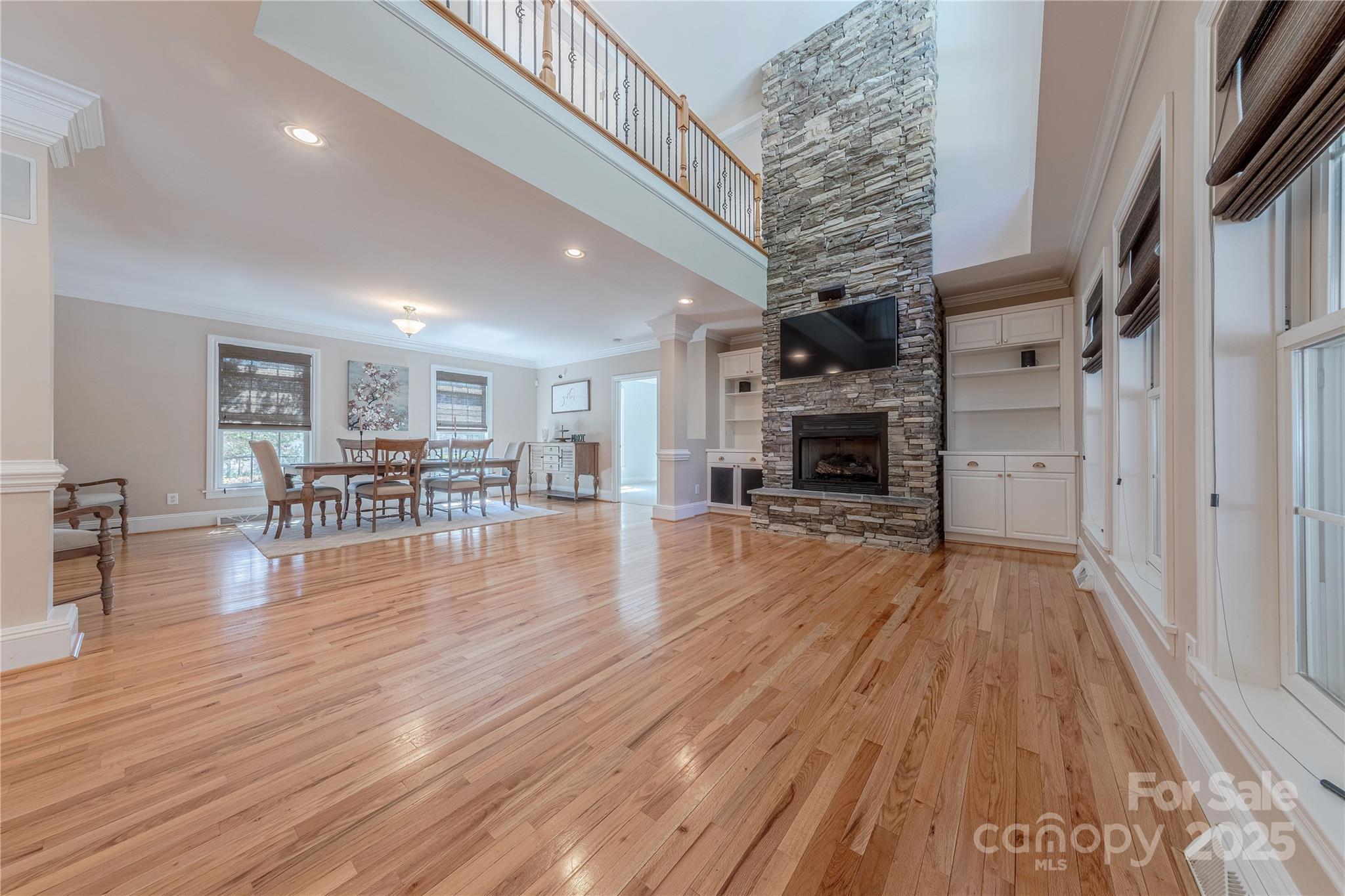 2174 McKee Road Fort Mill, SC 29708 - Photo 12 of 48 a view of a livingroom with furniture wooden floor fireplace and windows