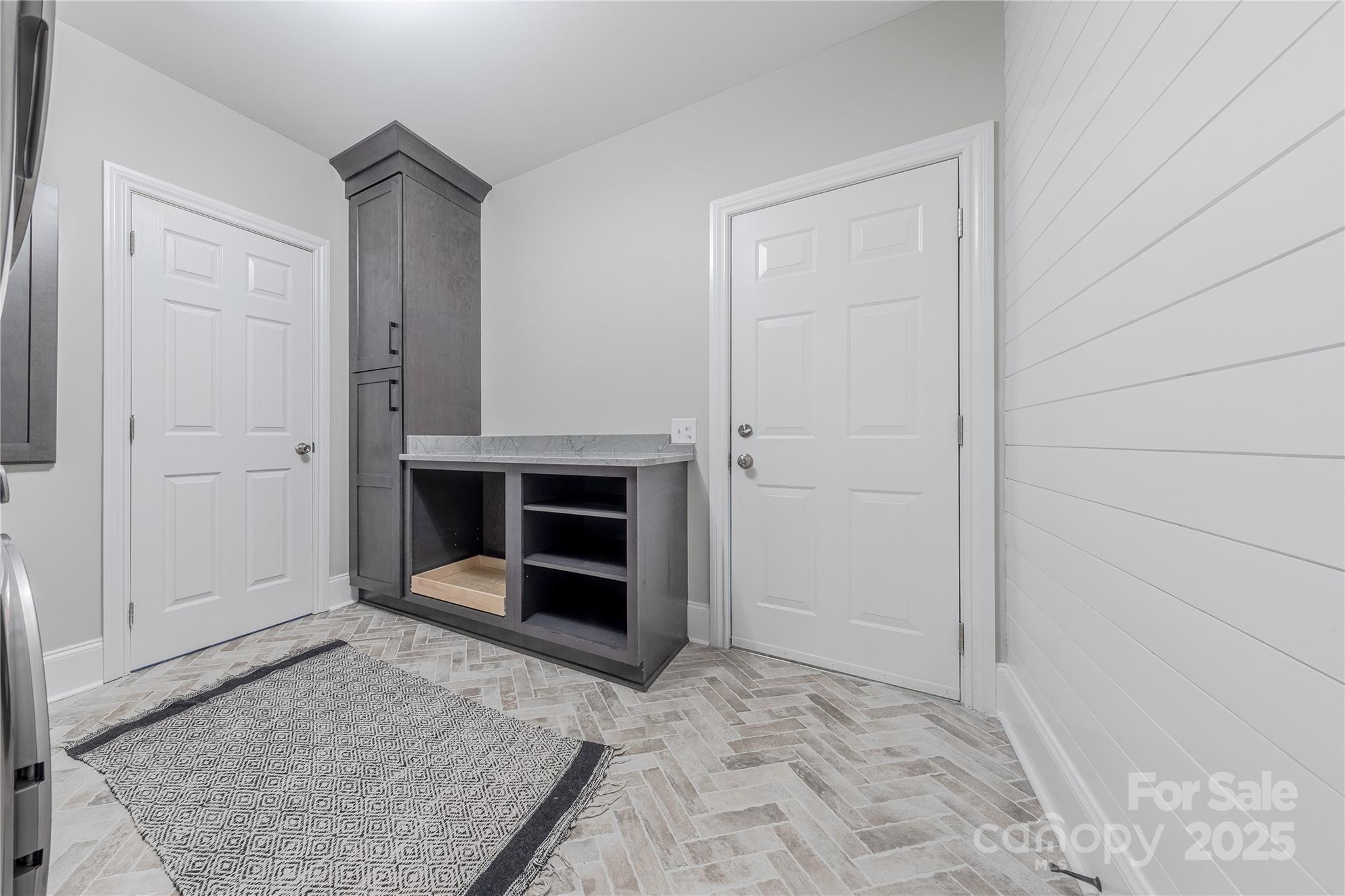 2174 McKee Road Fort Mill, SC 29708 - Photo 21 of 48 an empty room with a fireplace and cabinets