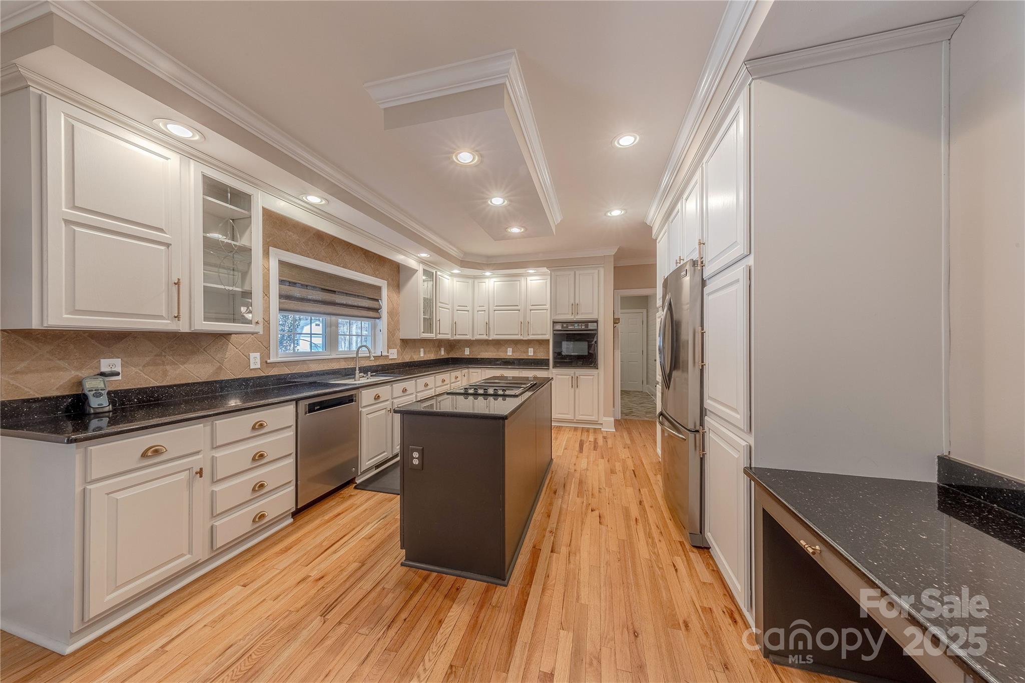 2174 McKee Road Fort Mill, SC 29708 - Photo 6 of 48 a kitchen with granite countertop a sink cabinets stainless steel appliances and a counter top space