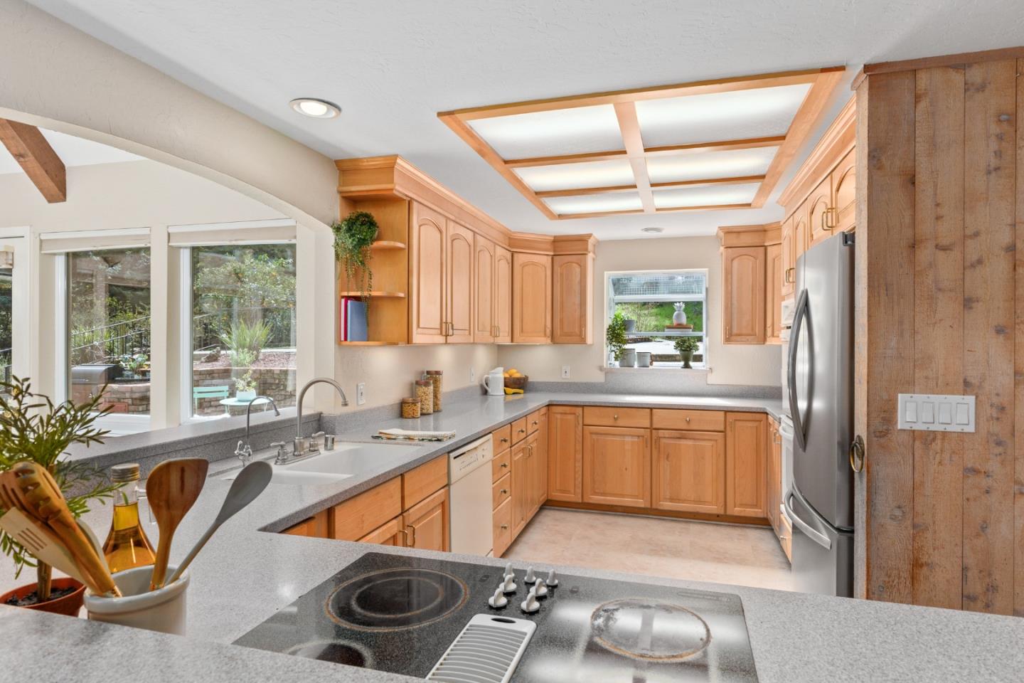 394 Summit Road Watsonville, CA 95076 - Photo 12 of 26 a kitchen with stainless steel appliances granite countertop a sink and cabinets